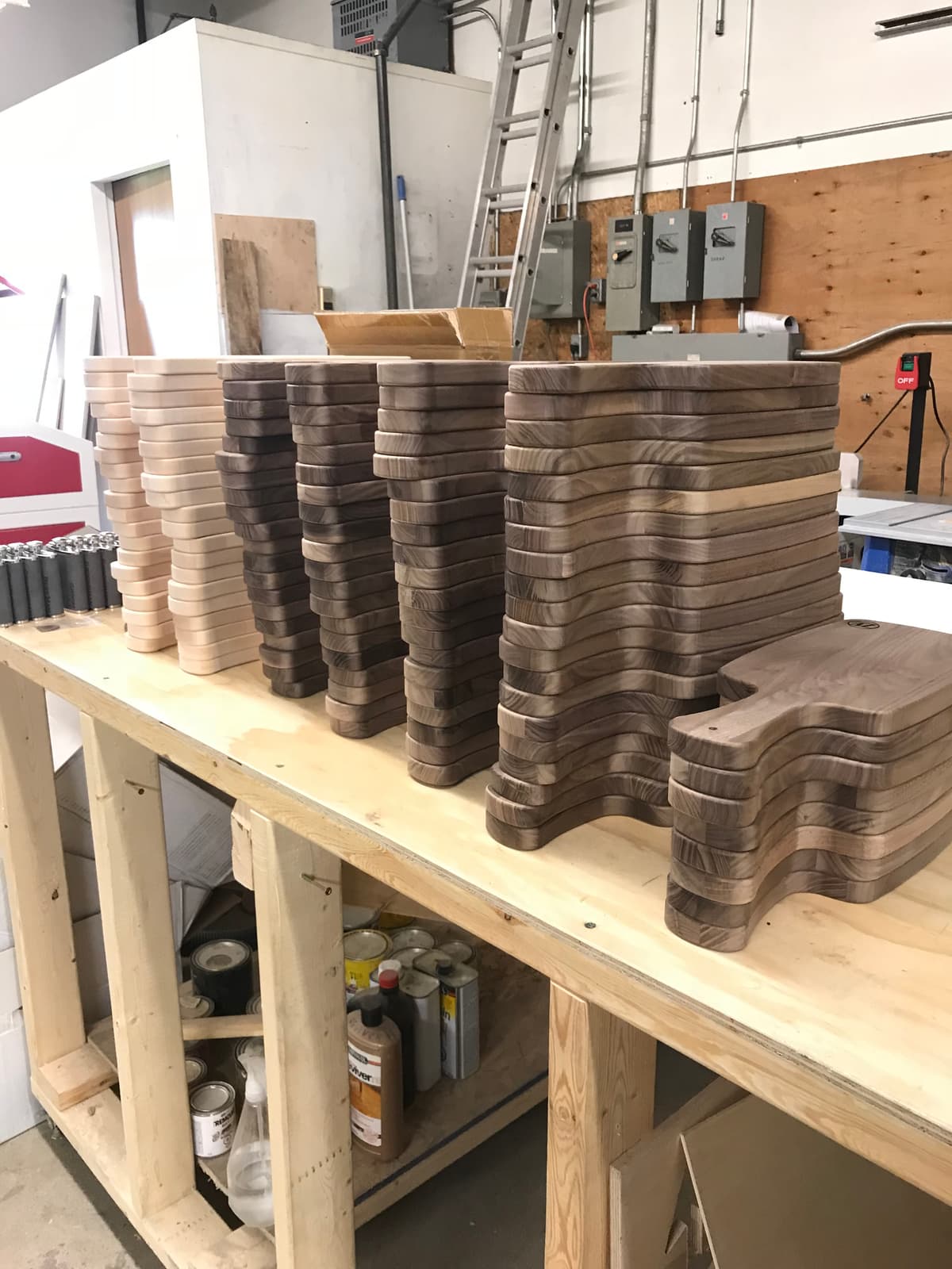 Large walnut cutting and cheese board order on workbench