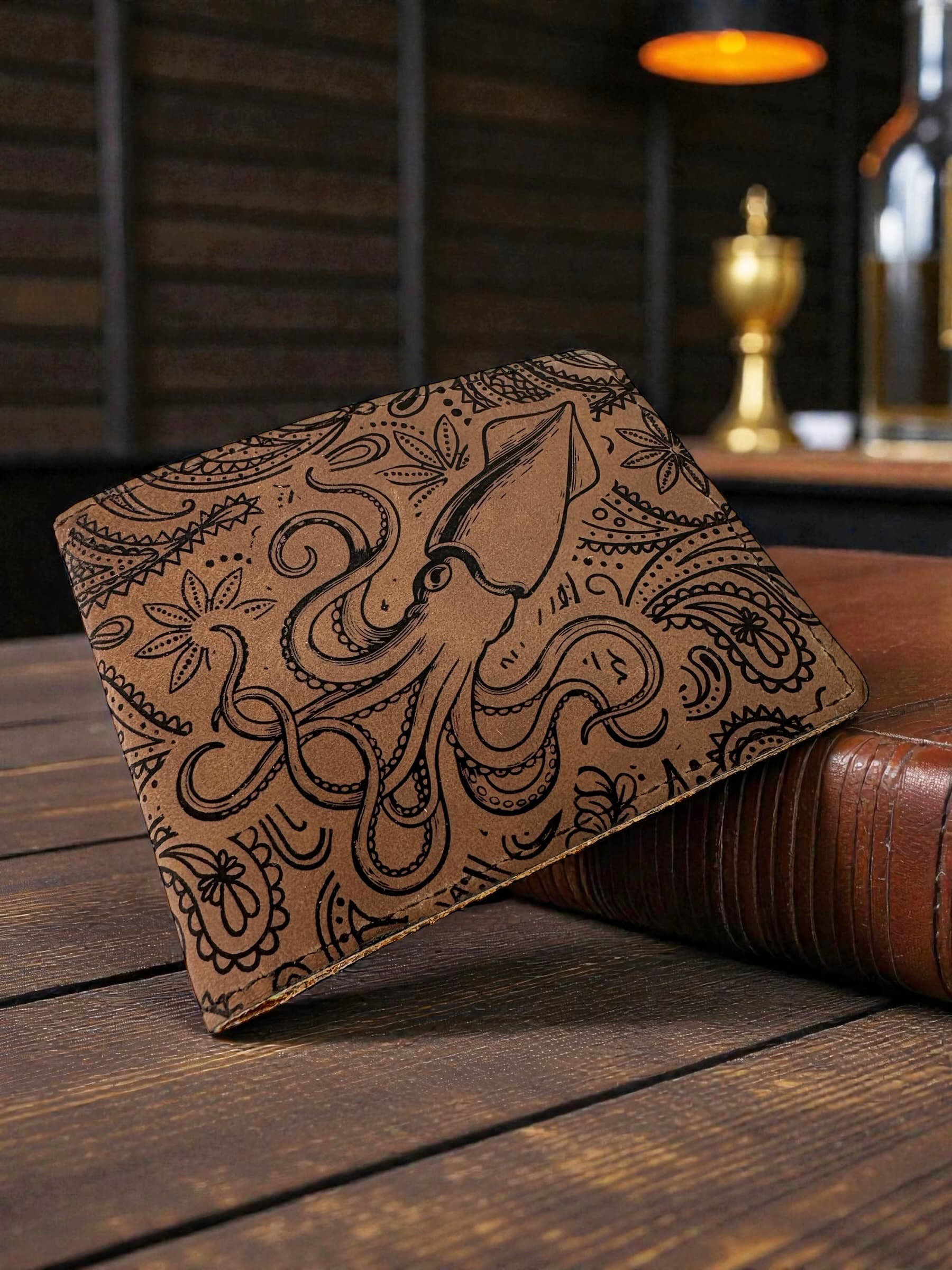 Custom leather wallet engraving featuring a Kraken intertwined with Paisley patterns