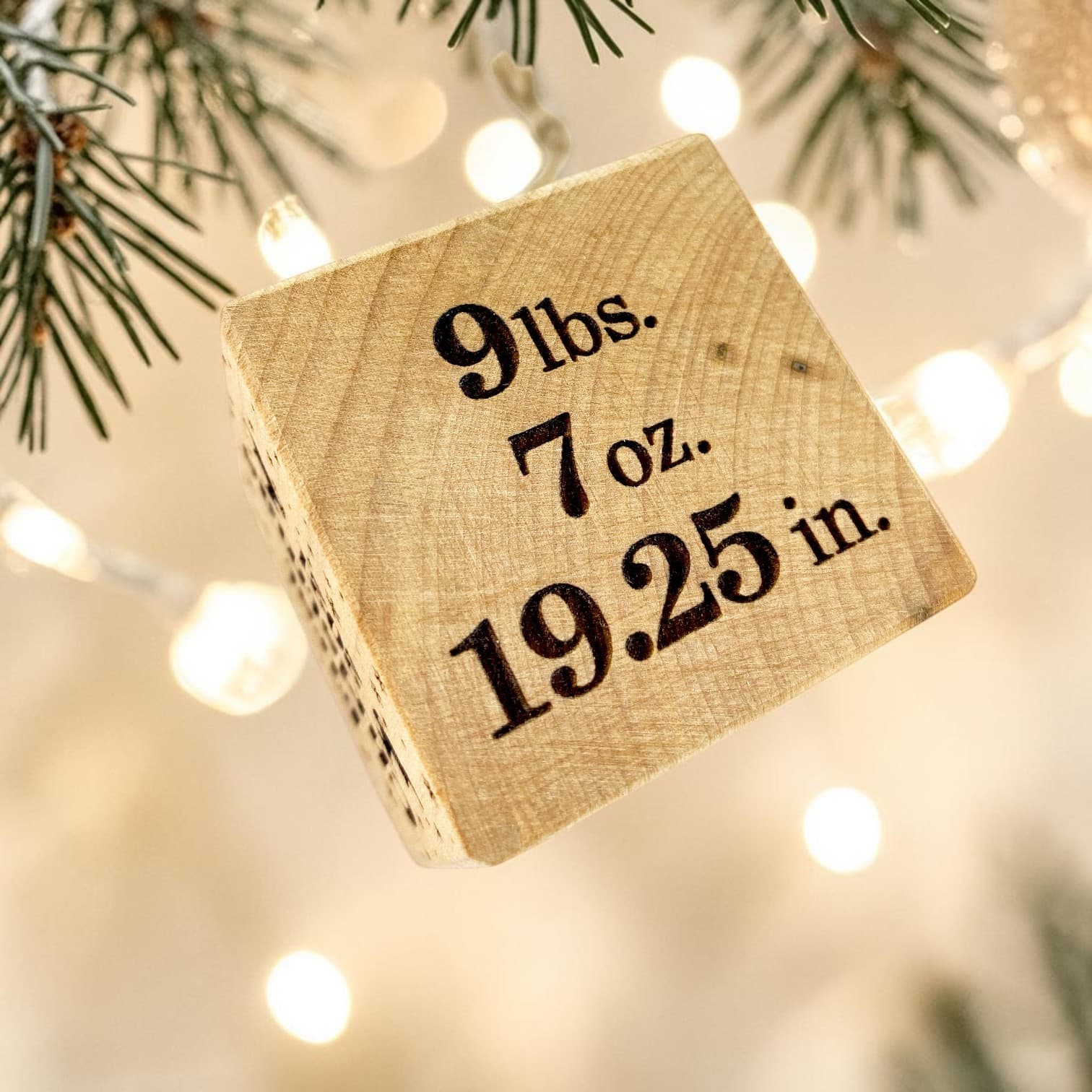 Weight and length — engraved detail on the First Christmas Block
